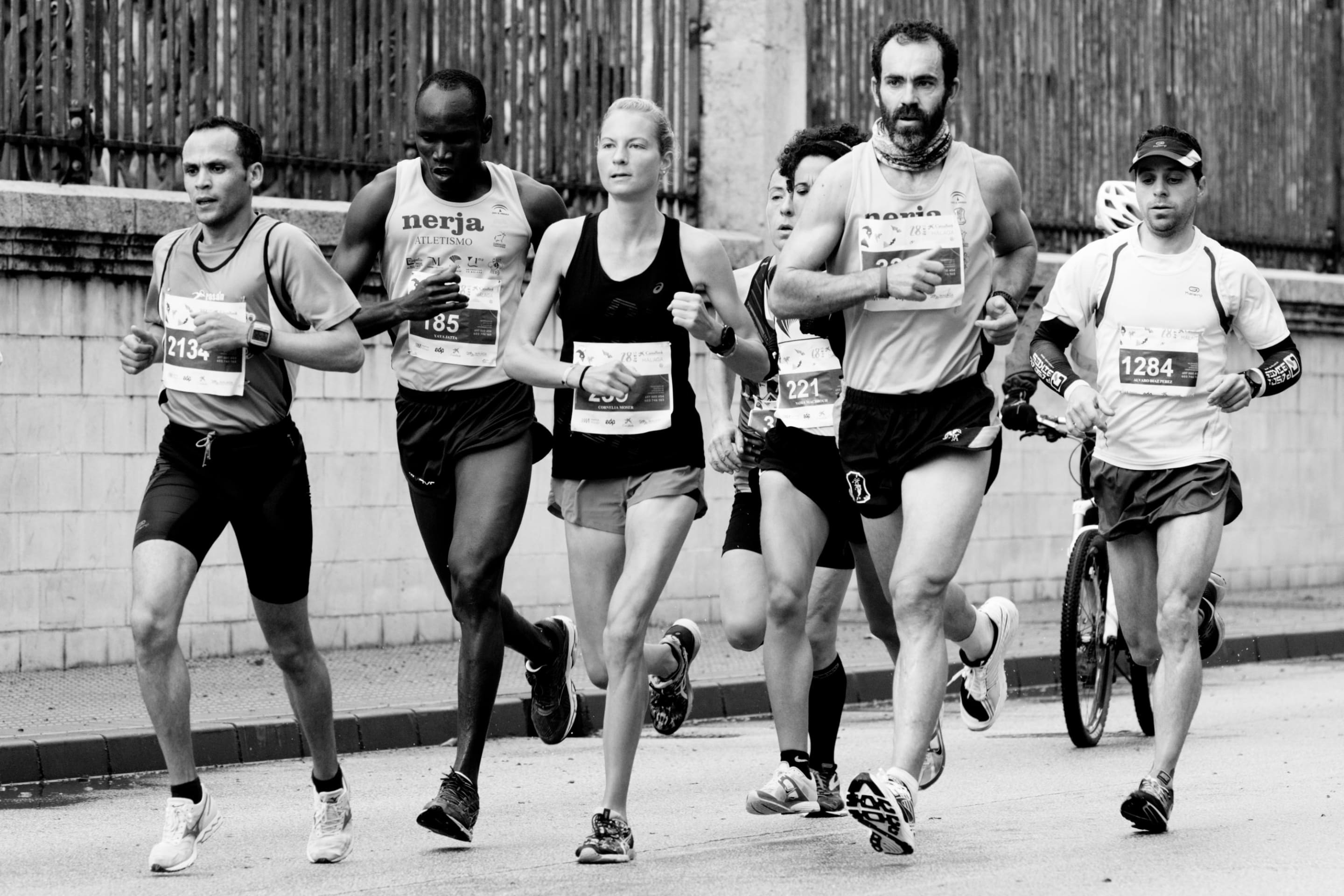 Black and white image of people running